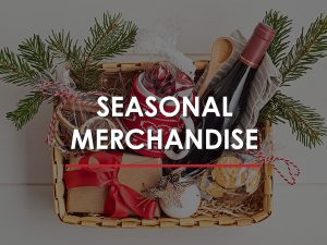 A gift basket from VooDu Marketing, filled with a bottle of wine, cheese, crackers, and other gourmet items.